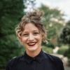 Headshot of Rafaela smiling outdoors