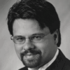 Black and white headshot of Mark
