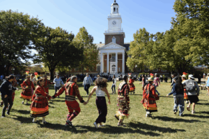 People dancing in a circle at the 2025 pow wow