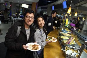 Students, staff, and faculty enjoy the first annual Mardi Gras celebration at Nolan's