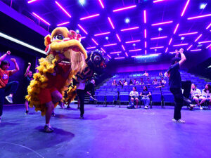 The Yong Han lion dance troupe practices in the theatre.