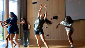 Students dancing in a large bright studio.