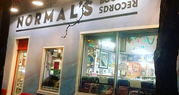 Exterior of a store with a sign that reads "Normal's Books and Records"