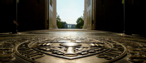 Floor view of a university seal.