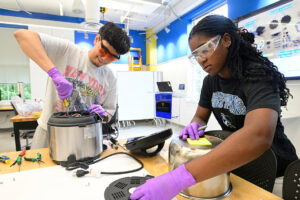 Two students work in a lab