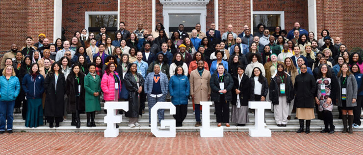 Large group photo with large letters "FGLI" in front 