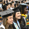 Rows of graduates seated wearing regalia